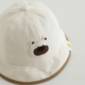 Cute baby sun hat with bear embroidery and soft textured fabric for summer UV protection