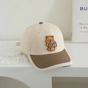 Close-up of contrast color cotton kids baseball cap with 3D cartoon bear embroidery