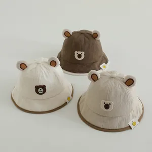 Detailed trio of cotton baby sun hats with bear ears in beige, khaki, and brown colors