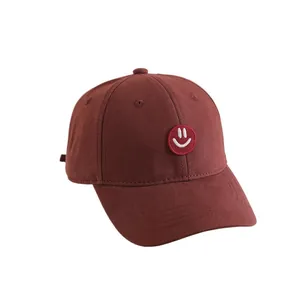 Deep burgundy cotton baseball cap for kids with smiling face embroidery patch