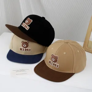 Kids color-block baseball cap featuring 3D bear embroidery and KIMI letters on flat brim
