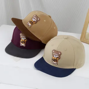 Kids flat brim baseball caps with 3D cartoon bear patches in three assorted color options