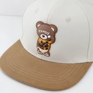 Two-tone baseball cap in beige and khaki with a 3D candy bear patch on a flat brim style