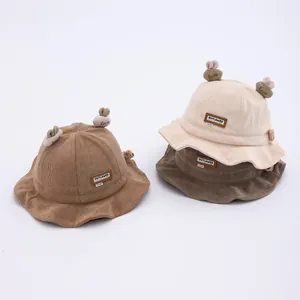 Corduroy baby bucket hats with cute bunny ears in beige and brown colors for kids