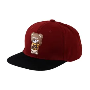 Flat brim baseball cap in burgundy and black featuring a 3D cartoon bear patch
