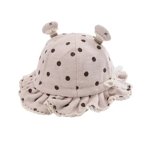Cute baby fisherman hat with brown polka dots, mushroom accents and lace bow detail