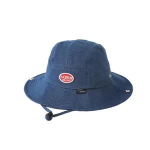 Kids wide brim dark blue denim bucket hat with red label and adjustable chin strap