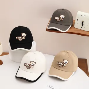 Detailed arrangement of four cartoon bear baseball caps in black, grey, white and khaki