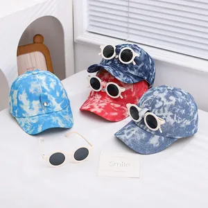 Detail of colorful tie-dye kids baseball caps with matching round sunglasses sets