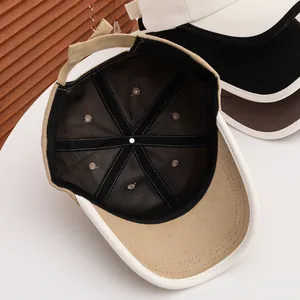 Detail of corduroy baseball cap showing fine stitching and multi-panel structure