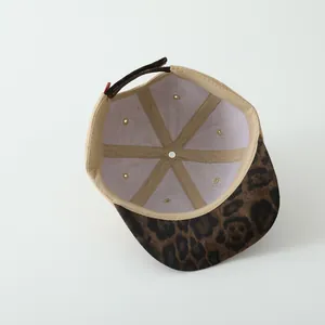 Macro detail of toddler leopard print baseball cap interior showing seams and strap