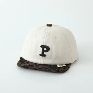 Kids baseball cap with P embroidery and leopard print brim in cream beige suede