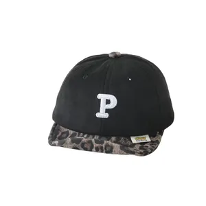 Kids baseball cap with black crown, leopard print brim, and white embroidered P letter