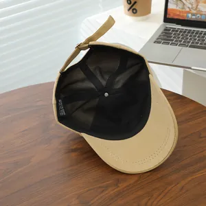 Detailed internal view of cotton baseball cap showing the 100% cotton label and quality stitching