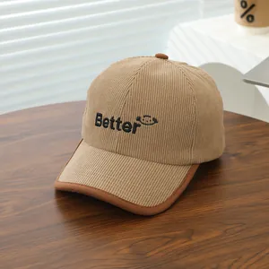 Detail of corduroy texture and BETTER embroidery on khaki kids' baseball cap