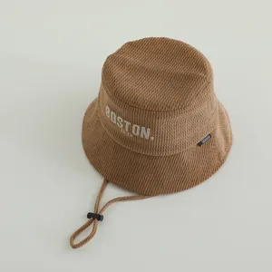 Brown corduroy bucket hat for toddlers with BOSTON embroidery and adjustable chin strap