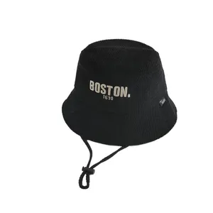 Kids black waffle knit bucket hat with yellow BOSTON embroidery and adjustable chin strap