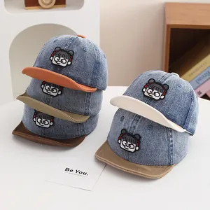 Various colors of denim baby baseball caps with cute cartoon embroidery patches
