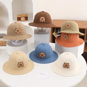 Close-up of children's cotton bucket hats with Capybara embroidery in multiple colors