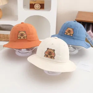 Cartoon Capybara bucket hats for toddlers in cream, orange and blue with windproof straps