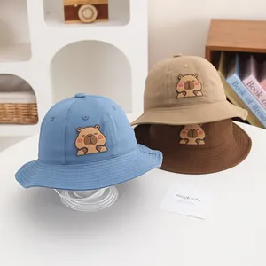 Child's bucket hat with Capybara cartoon embroidery in blue, khaki and brown colors
