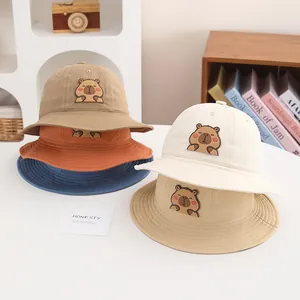 Group display of colorful cotton bucket hats for kids with cute cartoon animal patches