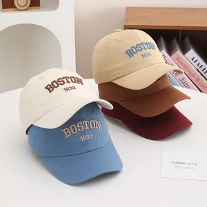 Detail of multi-color cotton baseball caps with high-density BOSTON embroidery