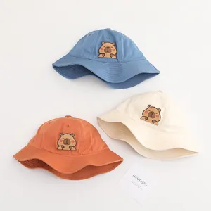 Cartoon Capybara bucket hats for kids in blue, orange and beige cotton fabric