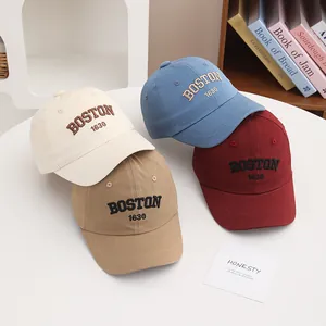 Close-up of four-color BOSTON 1630 embroidered cotton baseball caps for toddlers