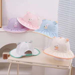 Detail of baby sun hat with breathable mesh back and adjustable velcro strap closure