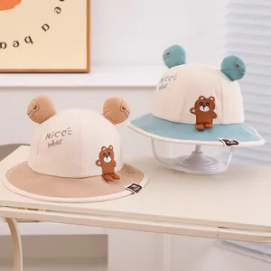 Detailed embroidery of NICE bear and 3D ears on a cotton baby sun hat with wind strap