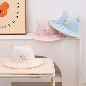 Detailed view of quick-dry baby sun hats with bunny ears and Lovely Summer embroidery
