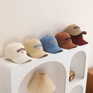 Detailed display of all six colors of the cotton BOSTON embroidered baby baseball caps