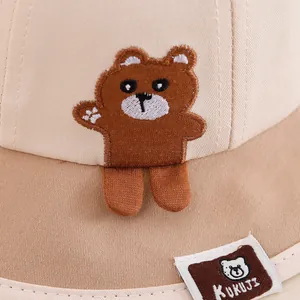 Kids cotton bucket hat with cute teddy bear embroidery and two-tone beige design