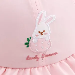 Close-up of pink sun hat featuring embroidered bunny and Lovely Summer text detail
