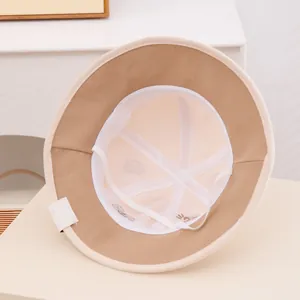 Children's bear bucket hat with breathable mesh lining and windproof cord in beige