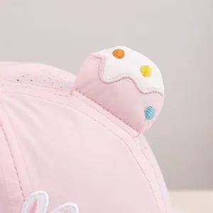 Detail of baby sun hat featuring breathable mesh fabric and 3D bunny ears with embroidery