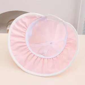 Detail of pink baby sun hat showing internal reinforced cross-stitching and breathable fabric