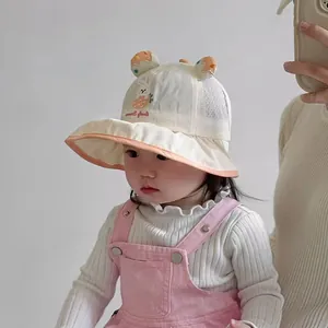 Detail of baby sun hat showing cute rabbit embroidery and breathable mesh side panels
