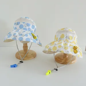 Detail of children's sun hat with breathable mesh windows and small bee decoration