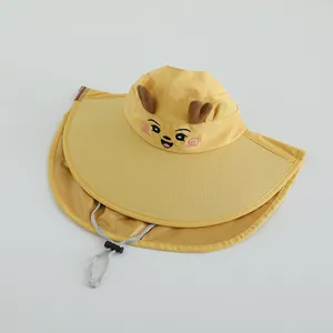 Detail of yellow kids sun hat showing cartoon embroidery and neck protection flap