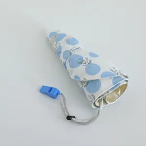 Detail of portable sun hat with blue dots pattern and mesh panel for breathability