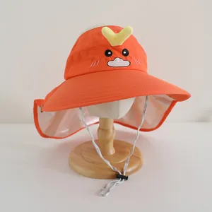 Detail of kids orange sun hat featuring cartoon embroidery and long protective neck flap