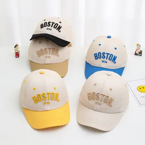 Detail of multi-color mesh baseball caps with BOSTON 1630 embroidery for kids