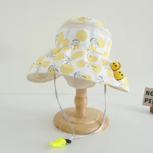 Detail of kids breathable sun hat with bee motifs, mesh top, and whistle chin strap