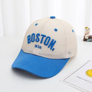 Close-up of BOSTON 1630 blue embroidery on breathable mesh kids baseball cap