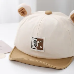 Close-up of the HH Bear patch and Mickey silhouette on this soft baby baseball cap