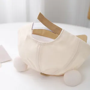 Detail of baby baseball cap with soft plush ears and adjustable velcro strap closure