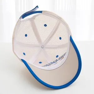 Detail of breathable mesh kids' baseball cap with blue brim and adjustable strap