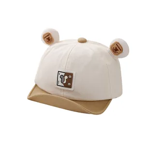 Infant canvas baseball cap with teddy bear ears in cream and khaki patchwork design